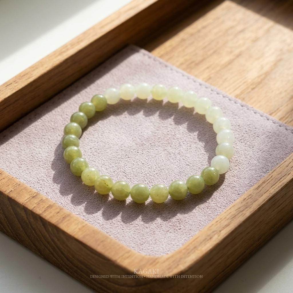 KAGAKI jade bracelet shown in soft natural light, a quiet study of jade color, cultural meaning, and spiritual jewelry ritual.