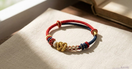 KAGAKI Breath Tibetan calming protection cord bracelet — gold knot detail in soft window light