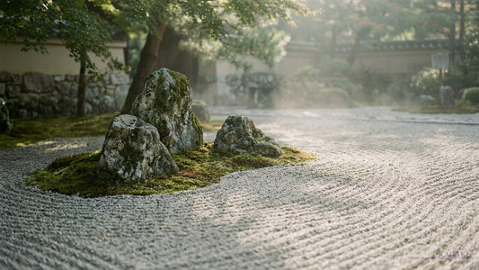 A quiet Japanese karesansui Zen garden with moss-covered stones and raked white sand in soft afternoon daylight beside a weathered wall, shown as an atmospheric hero image for a guide on Zen meditation and Japanese quietness.