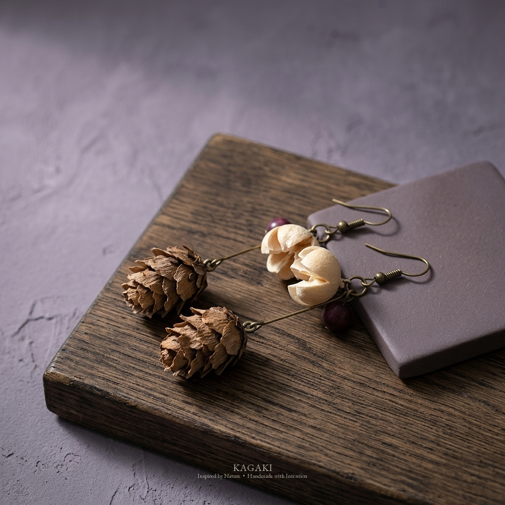 KAGAKI dried-botanical antique-brass handmade earrings with cream petal cluster and dried natural elements — zen refined still-life view.