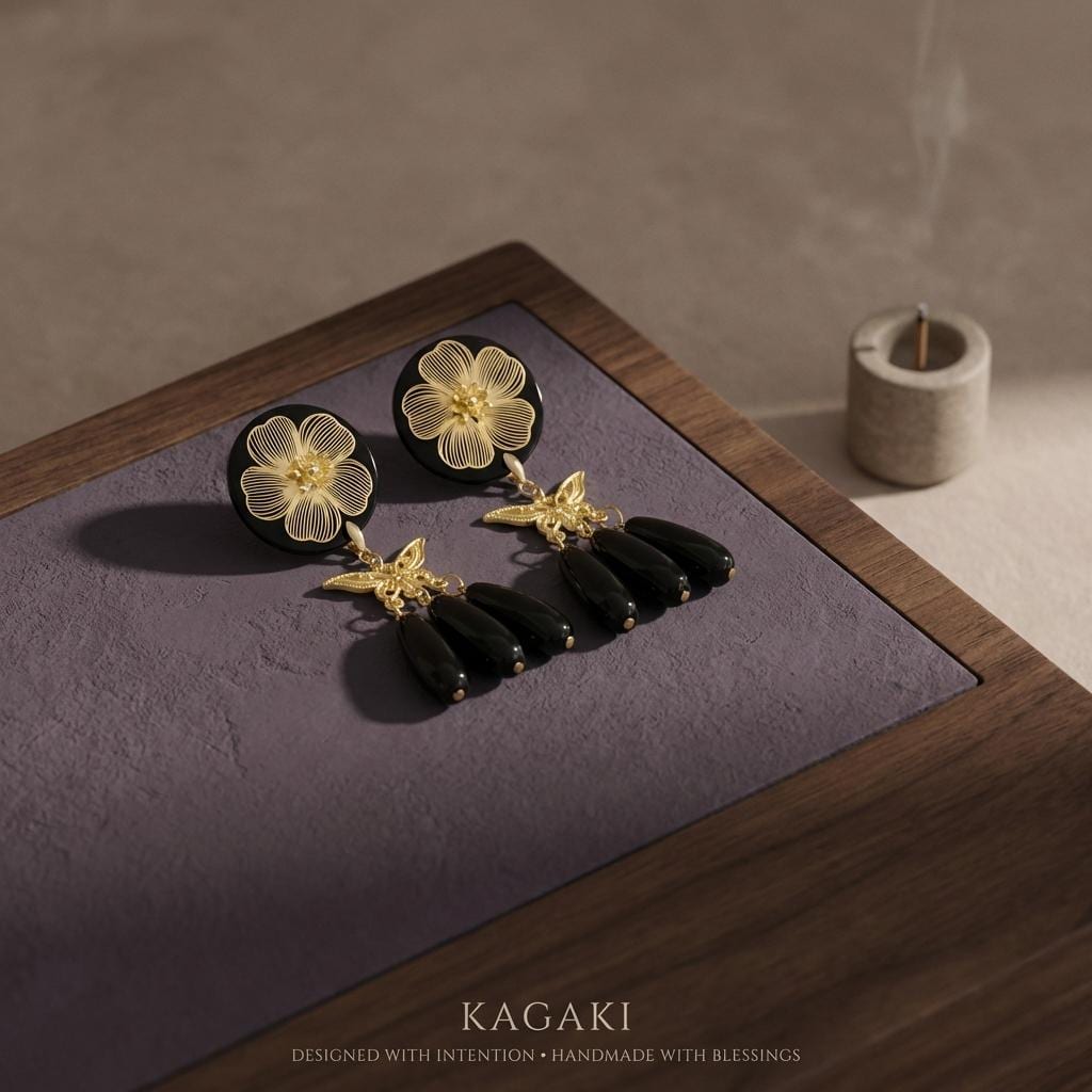 KAGAKI black gold floral butterfly earrings in black and gold, on ear, for daily wear and gifting