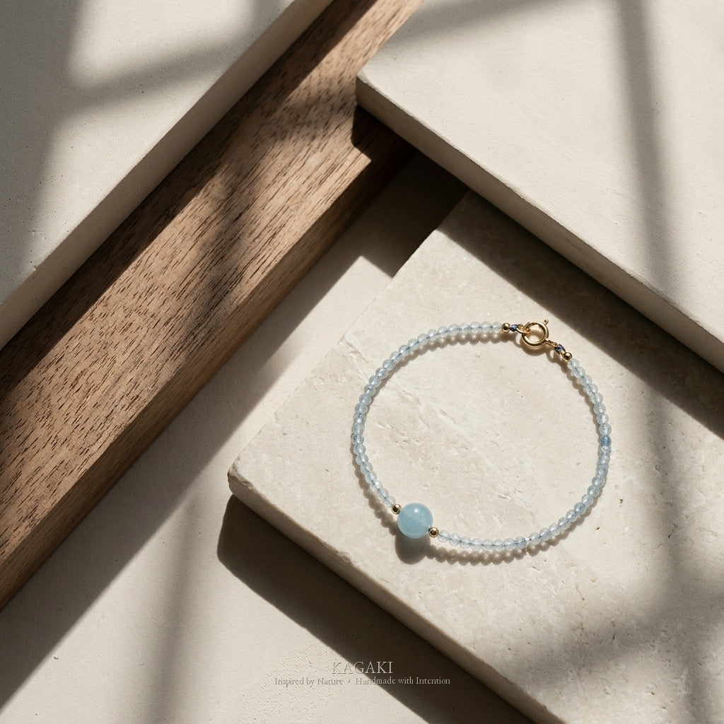 KAGAKI Brook aquamarine 14k gold bead bracelet, studio styled view, handmade aquamarine gold bracelet