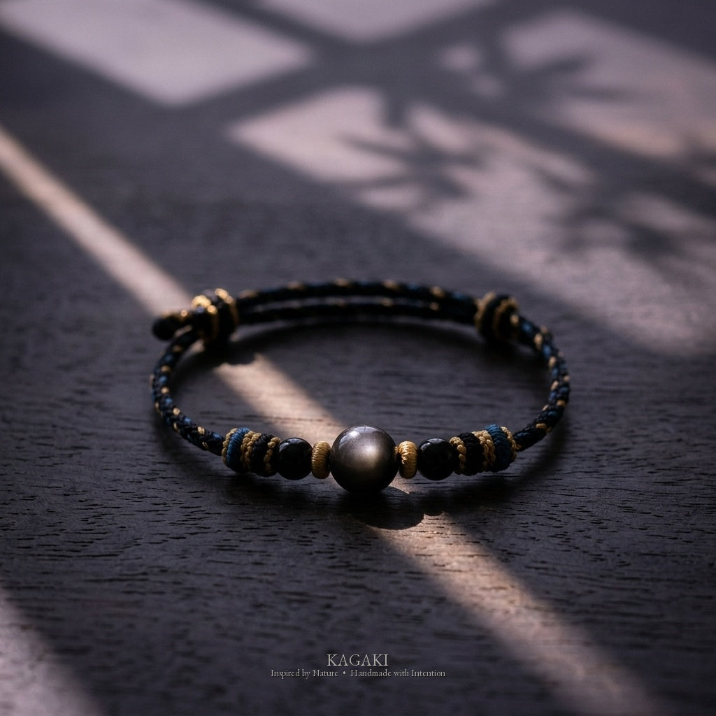 KAGAKI Ink black obsidian braided cord bracelet, studio styled view, handmade black obsidian bracelet