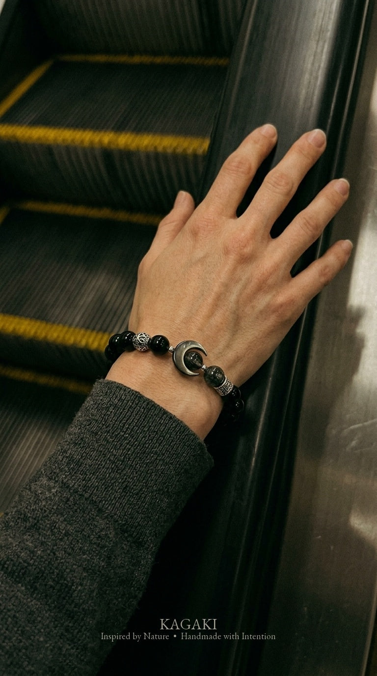 KAGAKI Nocturne black onyx silver crescent moon bracelet, worn view, handmade black onyx bracelet