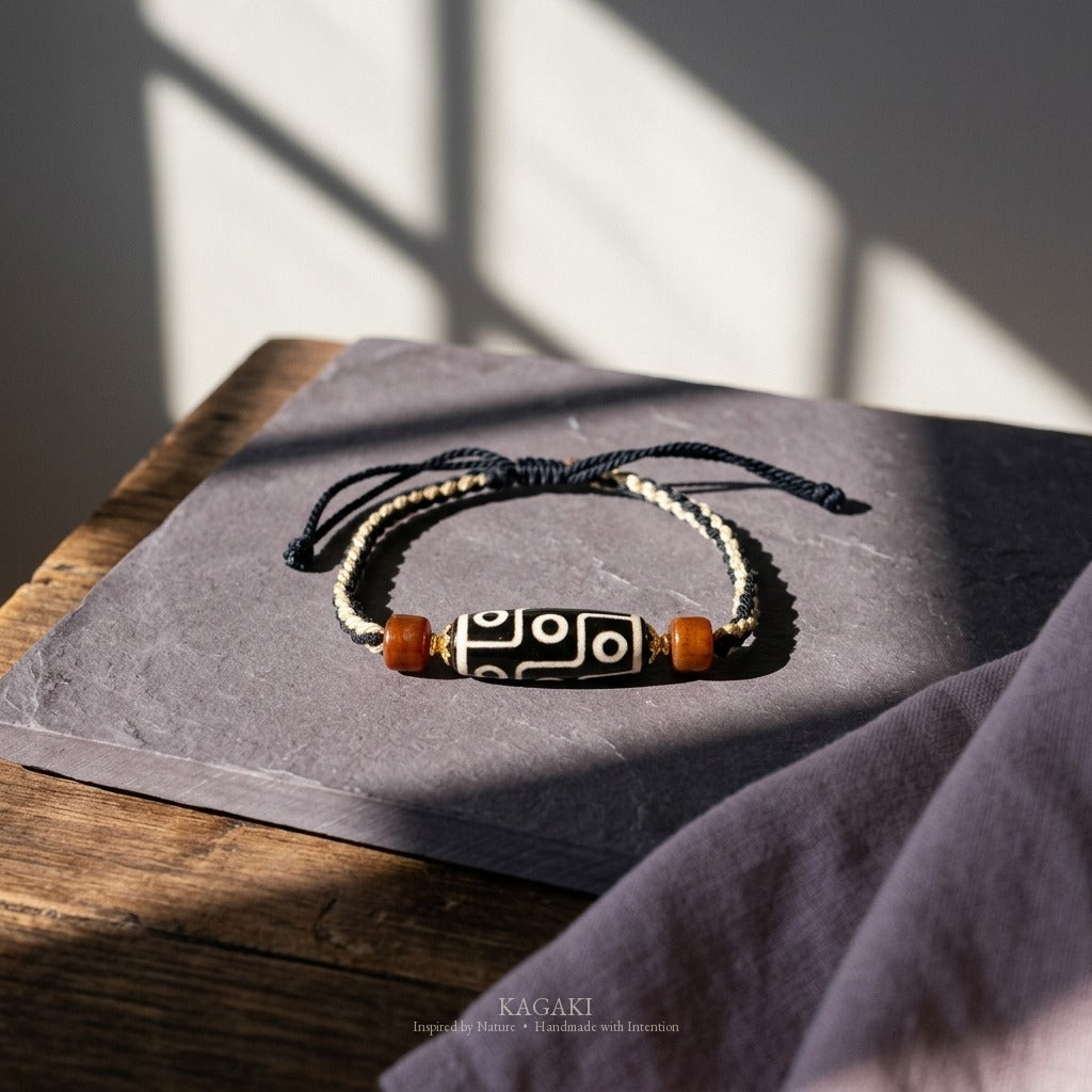 KAGAKI handmade Tibetan-inspired nine-eye Dzi-style cord bracelet — Vigil – 守 — styled-scene (2/11)