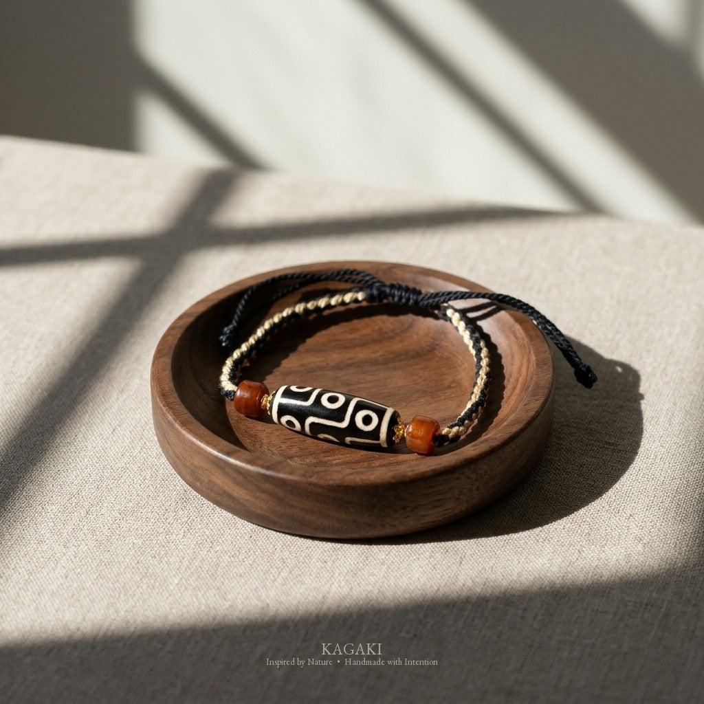 KAGAKI handmade Tibetan-inspired nine-eye Dzi-style cord bracelet — Vigil – 守 — styled-scene (6/11)