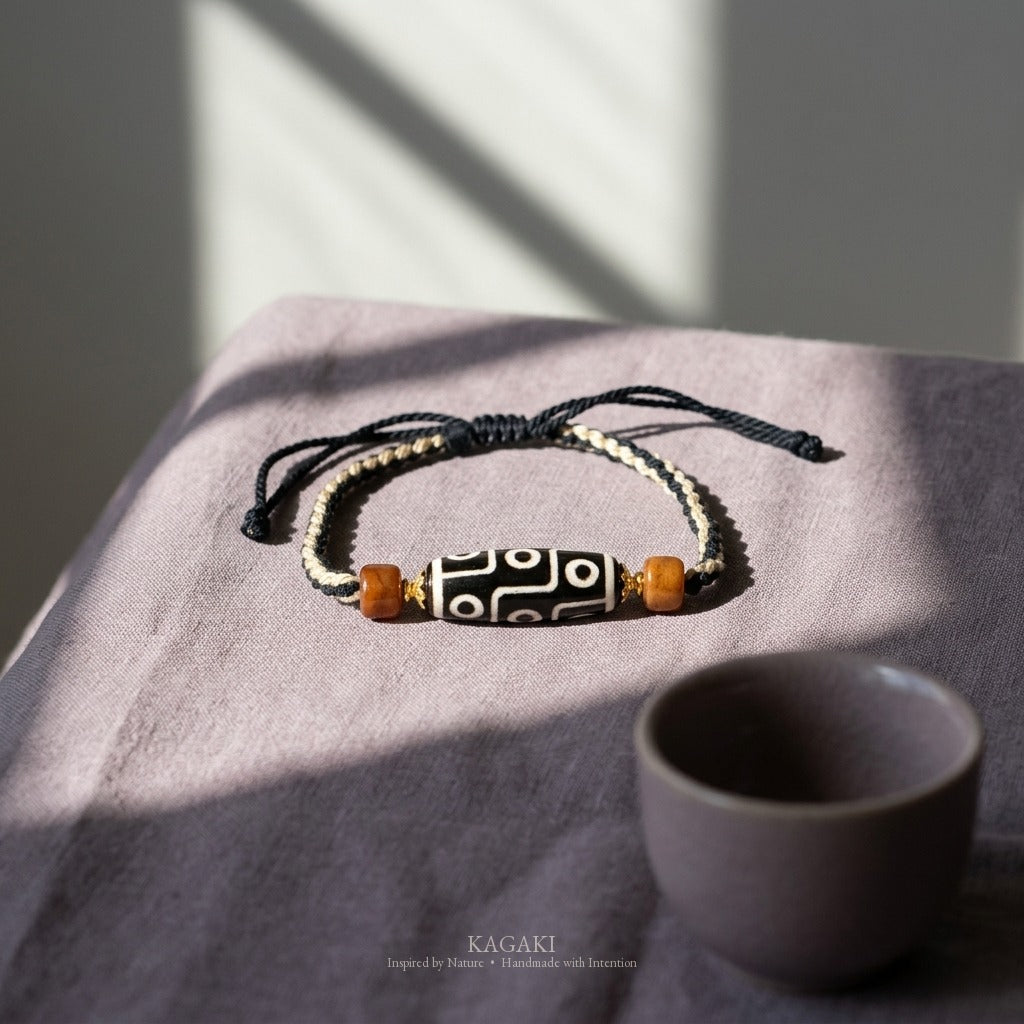 KAGAKI handmade Tibetan-inspired nine-eye Dzi-style cord bracelet — Vigil – 守 — styled-scene (7/11)