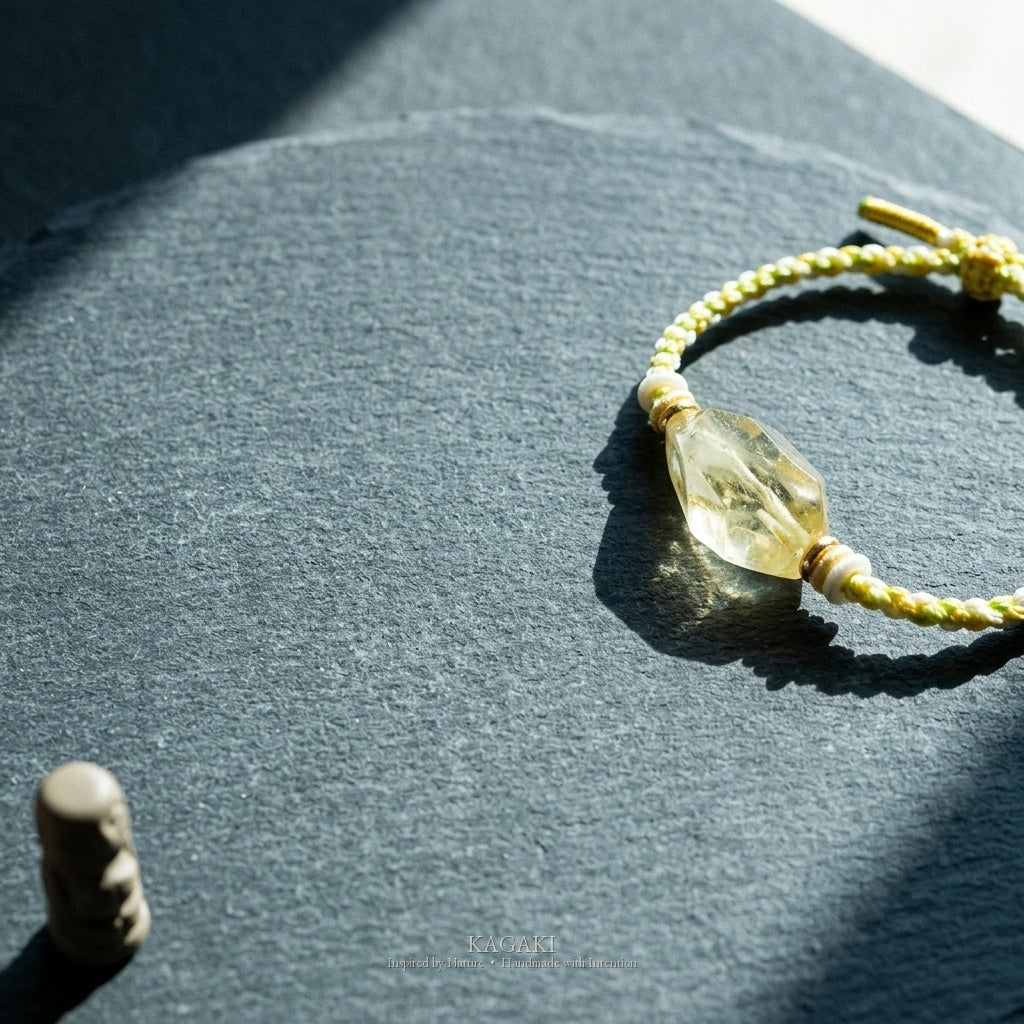 KAGAKI Honey raw citrine crystal tibetan cord bracelet, studio styled view, handmade citrine bracelet