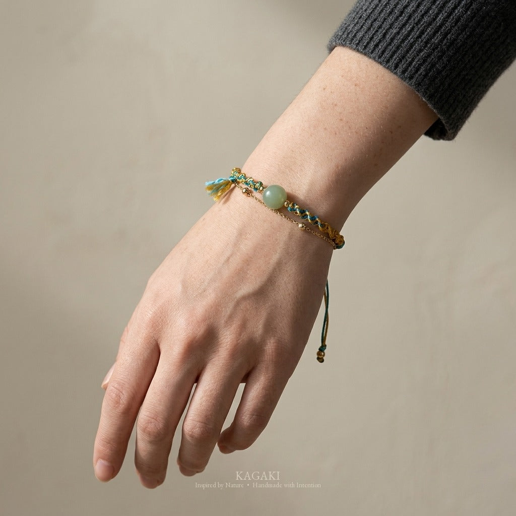 KAGAKI handmade cord bracelet double-layer jade cord bracelet — turquoise + gold + green, luxury jewelry editorial wearing shot.