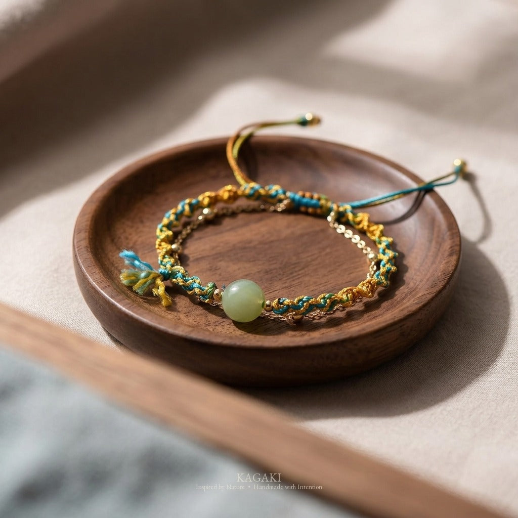 KAGAKI handmade cord bracelet double-layer jade cord bracelet — turquoise + gold + green, editorial styled scene.