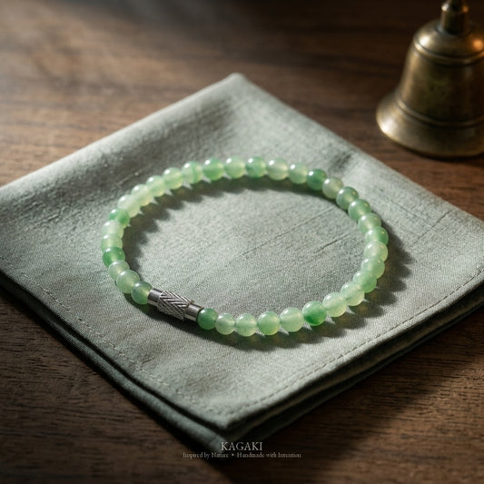 Sprout green jade beaded bracelet — floating green patterns, studio