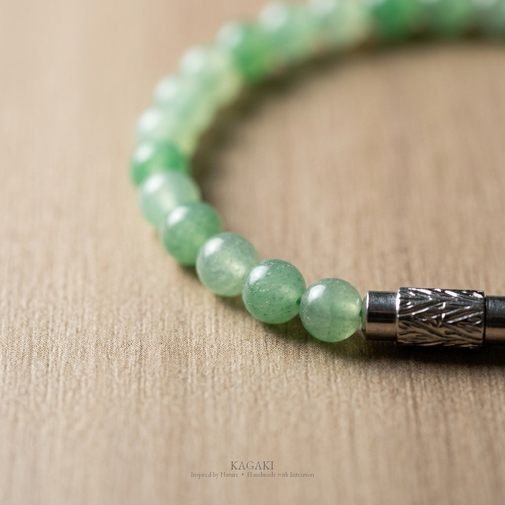 Green jade beads close-up — mottled green, natural variation