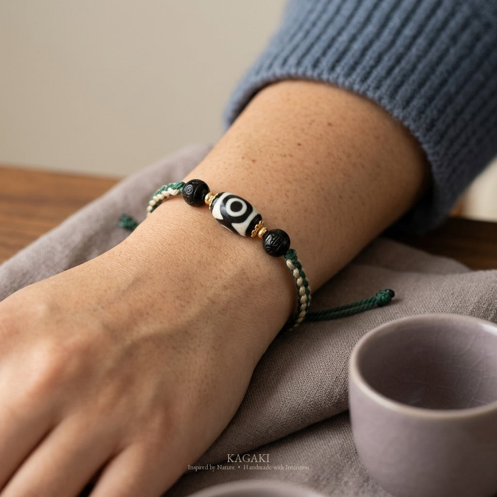 KAGAKI handmade Tibetan-inspired three-eye Dzi-style cord bracelet — Triad – 三 — on-wrist-lifestyle (5/11)