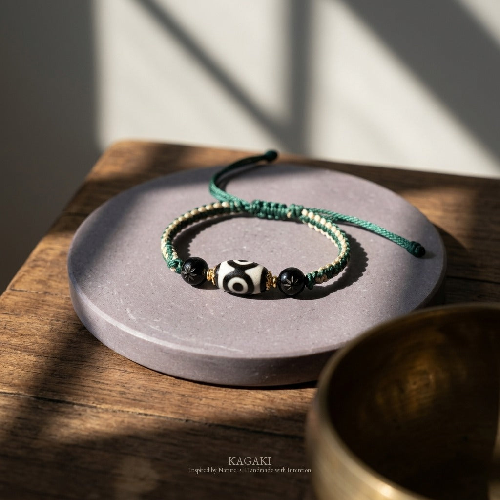 KAGAKI handmade Tibetan-inspired three-eye Dzi-style cord bracelet — Triad – 三 — styled-scene (2/11)