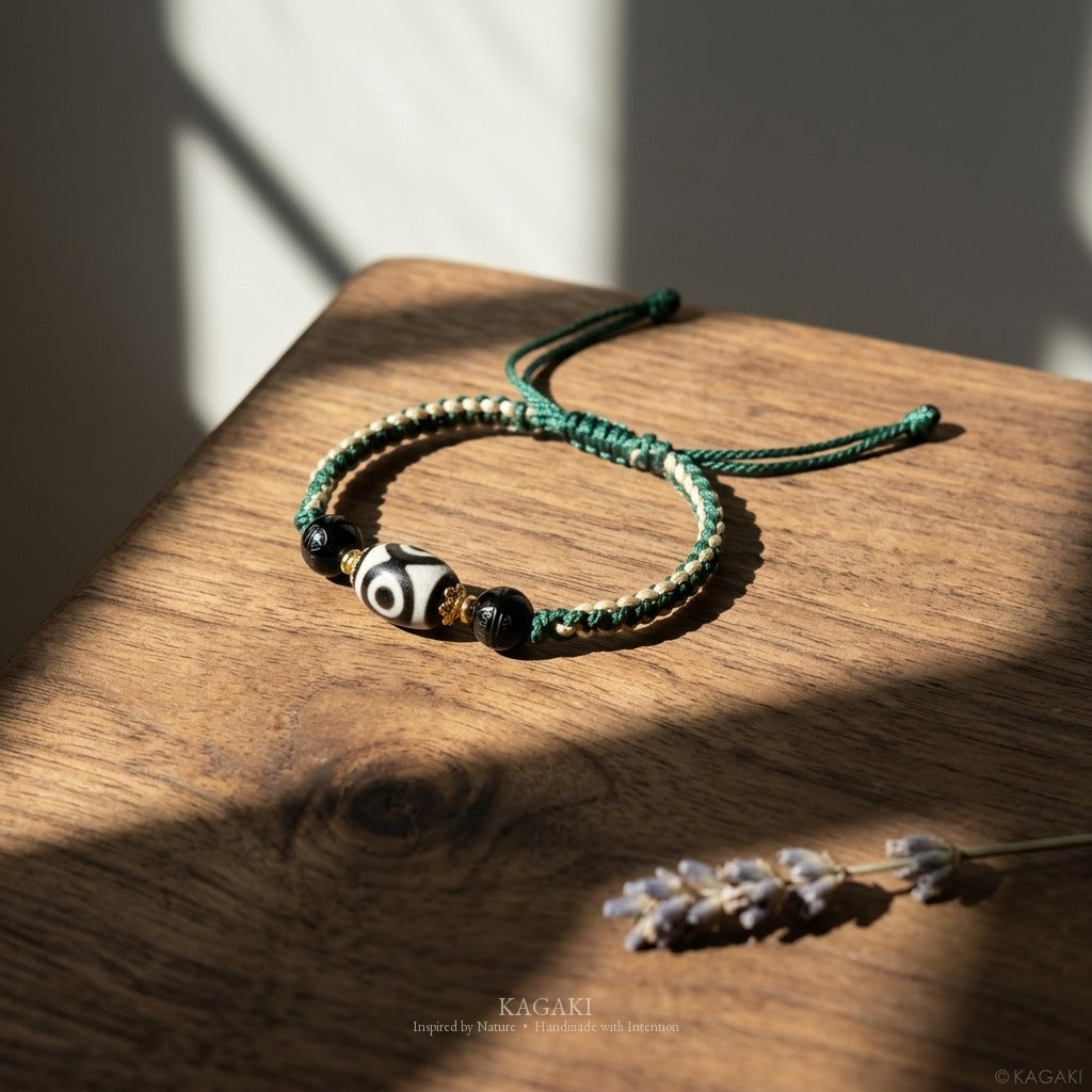 KAGAKI handmade Tibetan-inspired three-eye Dzi-style cord bracelet — Triad – 三 — styled-scene (6/11)