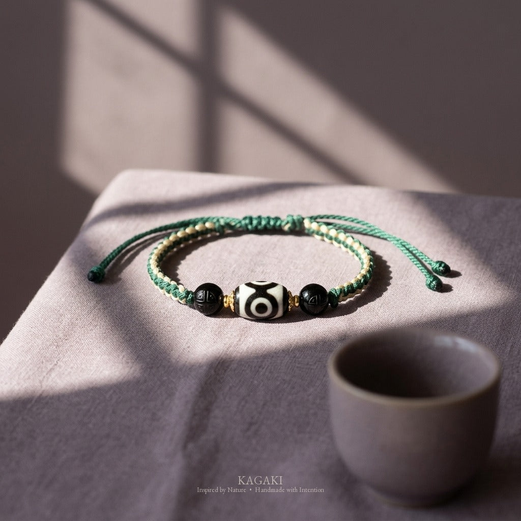 KAGAKI handmade Tibetan-inspired three-eye Dzi-style cord bracelet — Triad – 三 — styled-scene (7/11)