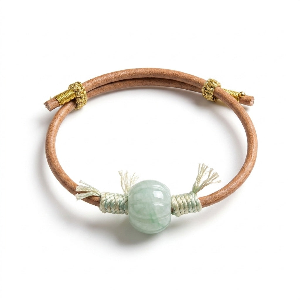 KAGAKI Canyon smooth pale green Jadeite barrel bead leather cord bracelet, green tassel wraps, gold-thread slider, white back