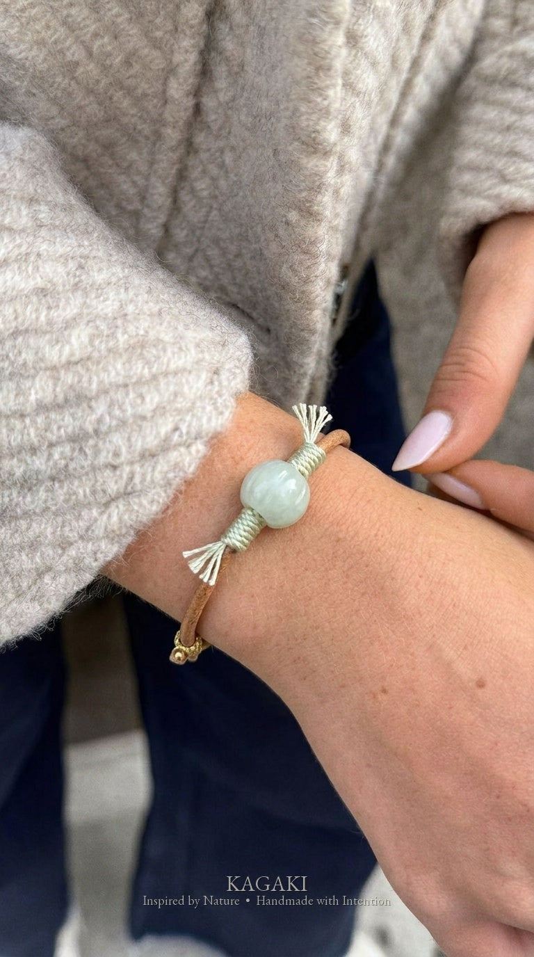 KAGAKI Canyon smooth pale green Jadeite barrel bead leather cord bracelet, green tassel wraps, gold-thread slider, worn on wr