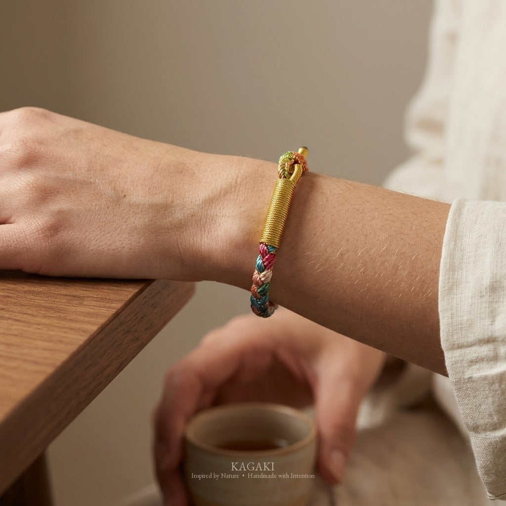 KAGAKI handmade cord bracelet rainbow gradient braided cord bracelet — full rainbow + gold thread, wrist wearing image.