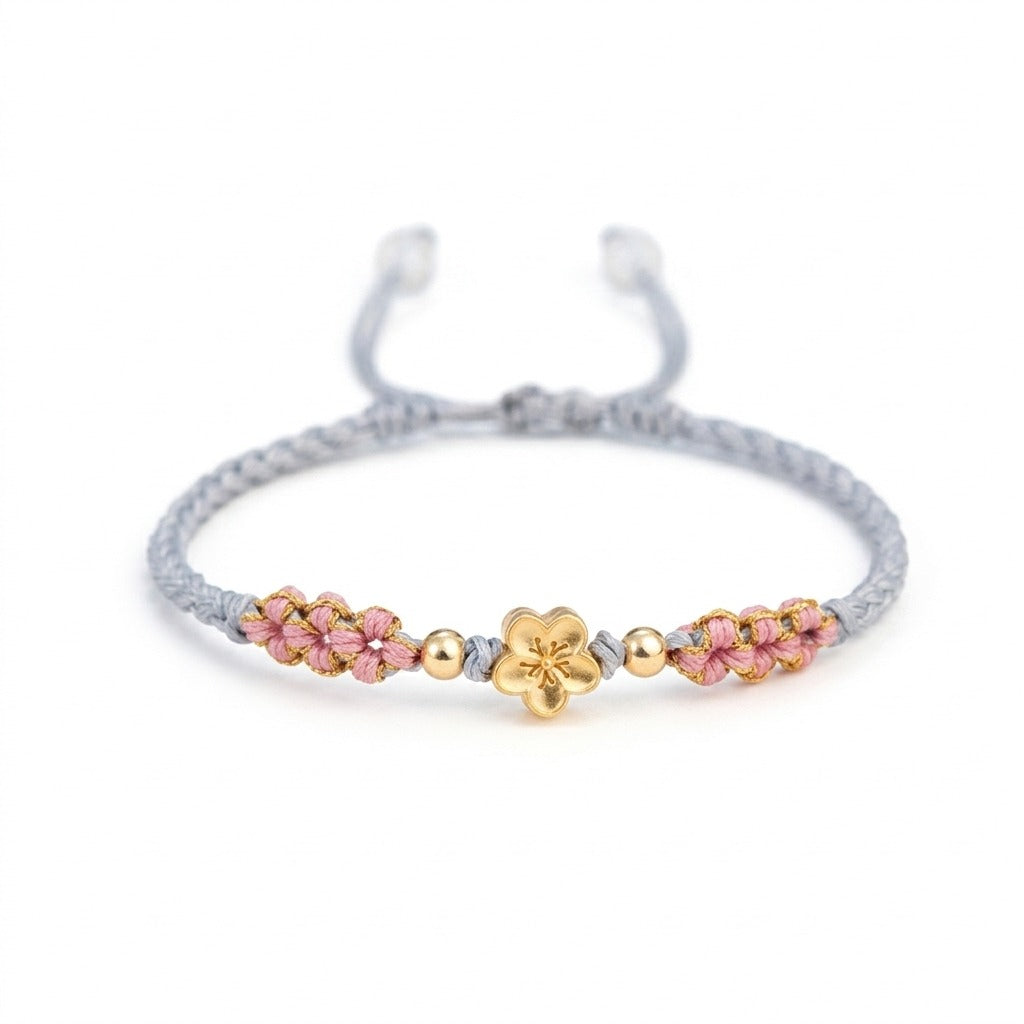 KAGAKI handmade cord bracelet sakura pastel cord bracelet (mist & petal) — mist blue or dawn pink with gold accent, main catalog image on white.