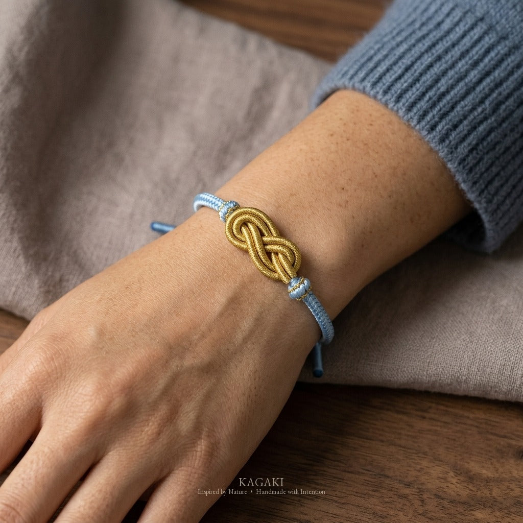 KAGAKI Azure sky blue infinity knot cord, wrist view, infinity knot spiritual marker