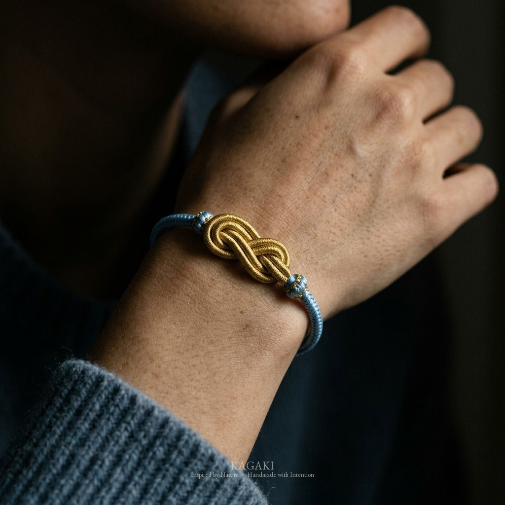KAGAKI Azure sky blue infinity knot cord, wrist view, infinity knot spiritual marker