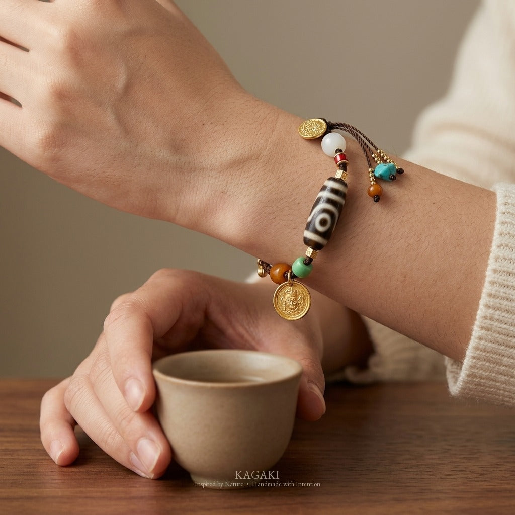 KAGAKI handmade cord bracelet tibetan dzi cord bracelet — brown + black + gold, wrist wearing image.