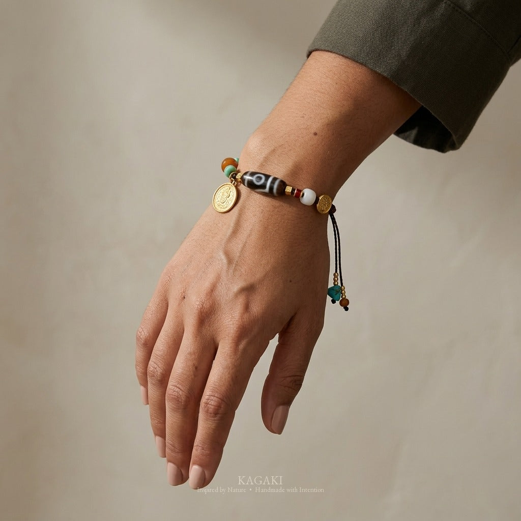 KAGAKI handmade cord bracelet tibetan dzi cord bracelet — brown + black + gold, luxury jewelry editorial wearing shot.