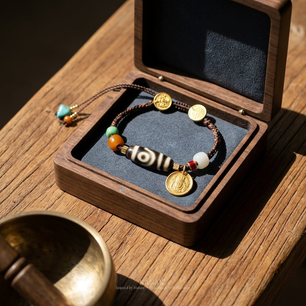 KAGAKI handmade cord bracelet tibetan dzi cord bracelet — brown + black + gold, editorial styled scene.
