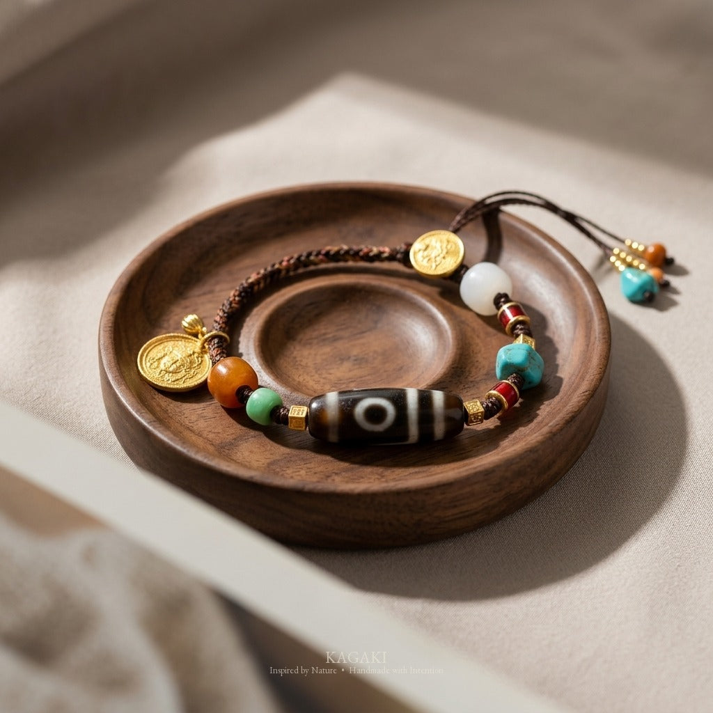 KAGAKI handmade cord bracelet tibetan dzi cord bracelet — brown + black + gold, editorial styled scene.