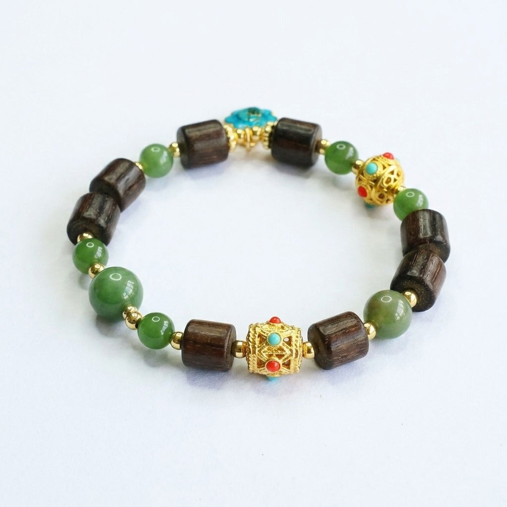 KAGAKI handmade crystal bracelet tibetan jade agarwood beaded bracelet — green + dark brown + gold, main catalog image on white.