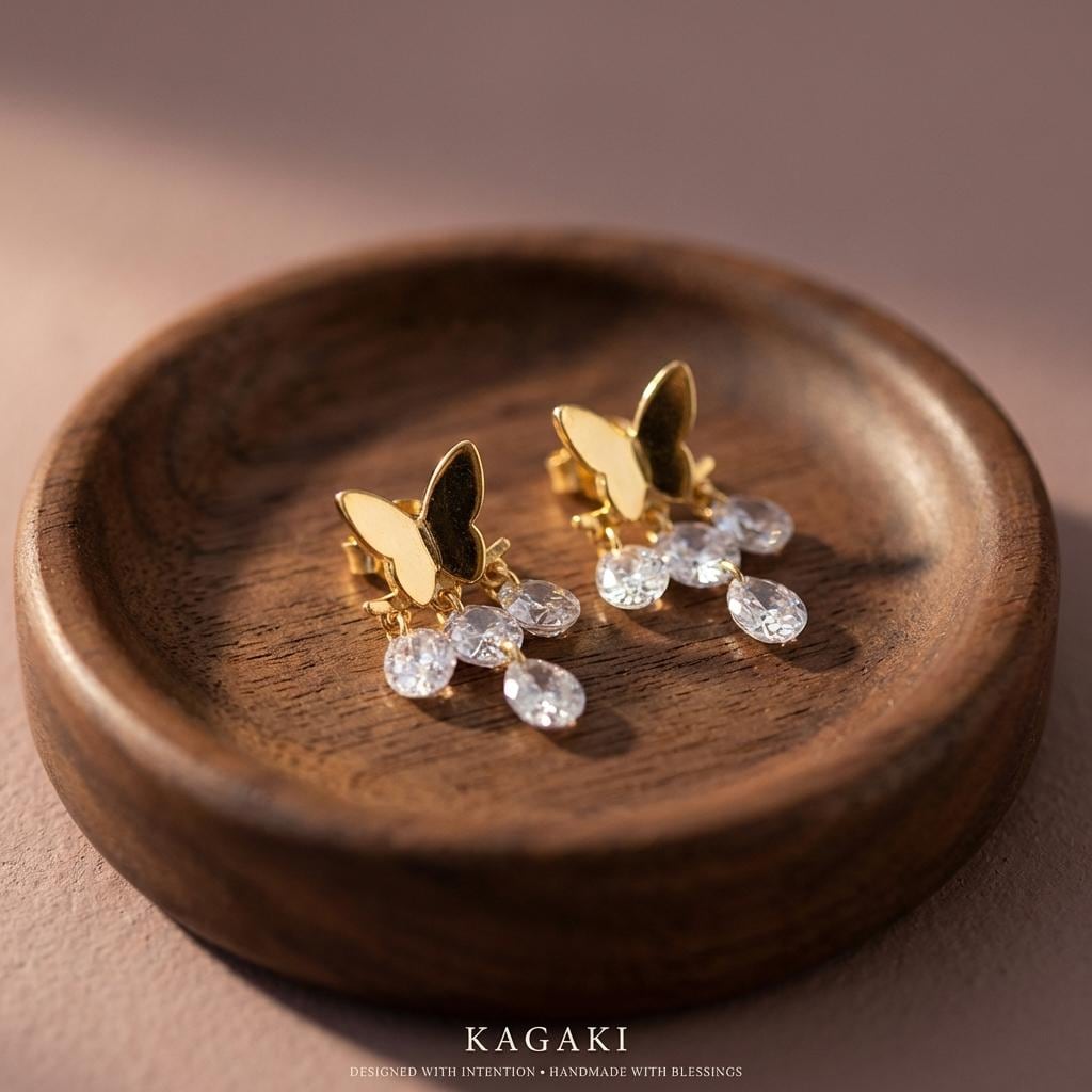 KAGAKI butterfly crystal drop earrings in gold with clear crystal, on ear, for daily wear and gifting