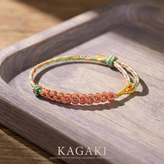 KAGAKI cherry-blossom sakura bracelet in soft pink handwoven cord with floral knot, main product view, for renewal and gentle protection