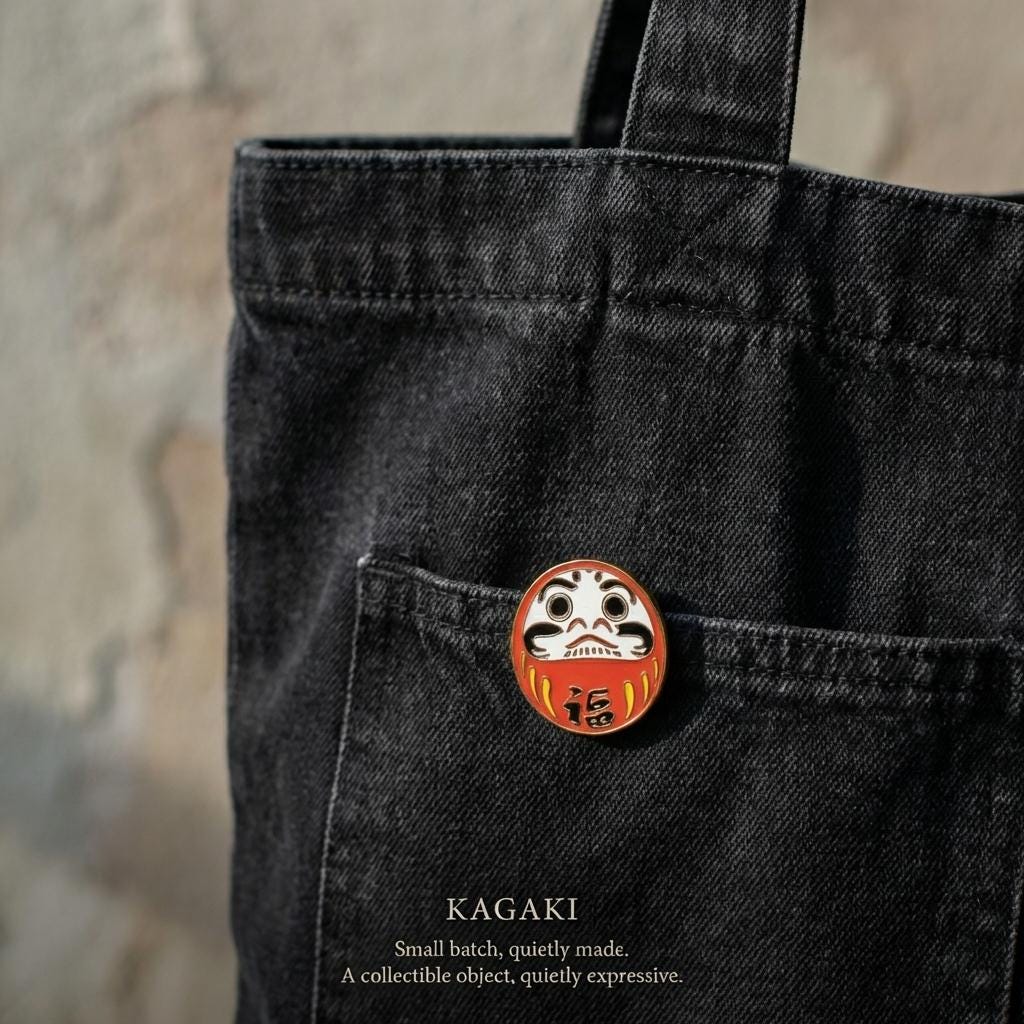 KAGAKI daruma lucky enamel pin in classic Daruma red and gold, detail, for daily wear and gifting
