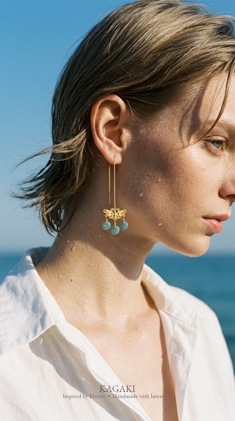 KAGAKI Monarch gold butterfly blue jadeite earrings, worn view, handmade butterfly earrings gold