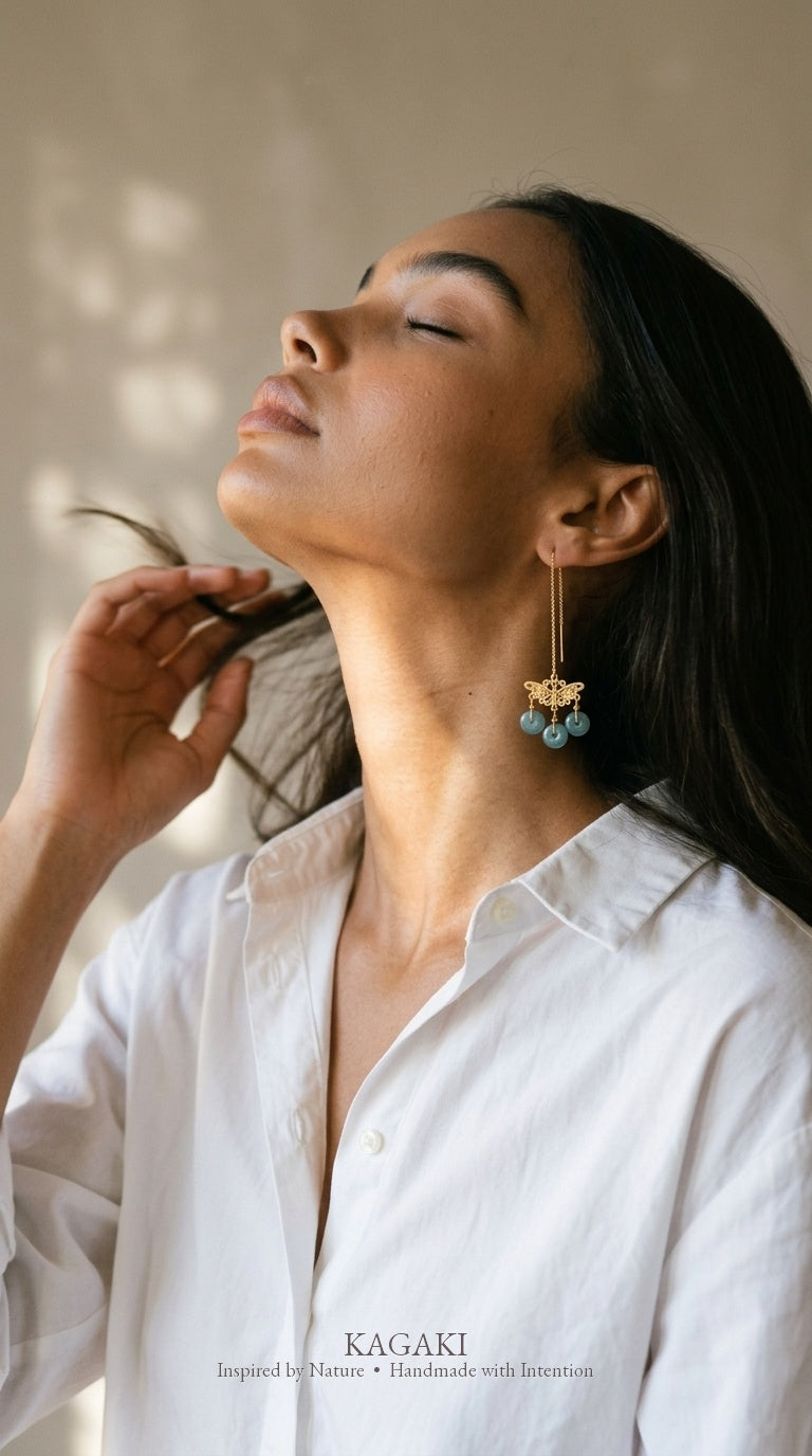 KAGAKI Monarch gold butterfly blue jadeite earrings, worn view, handmade butterfly earrings gold