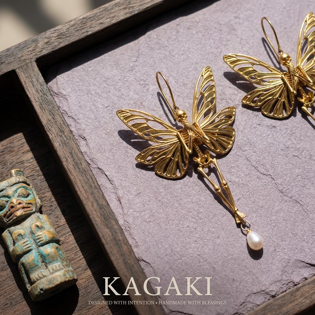 KAGAKI gothic butterfly skull earrings in gold, pearl, dark accents, on ear, for daily wear and gifting