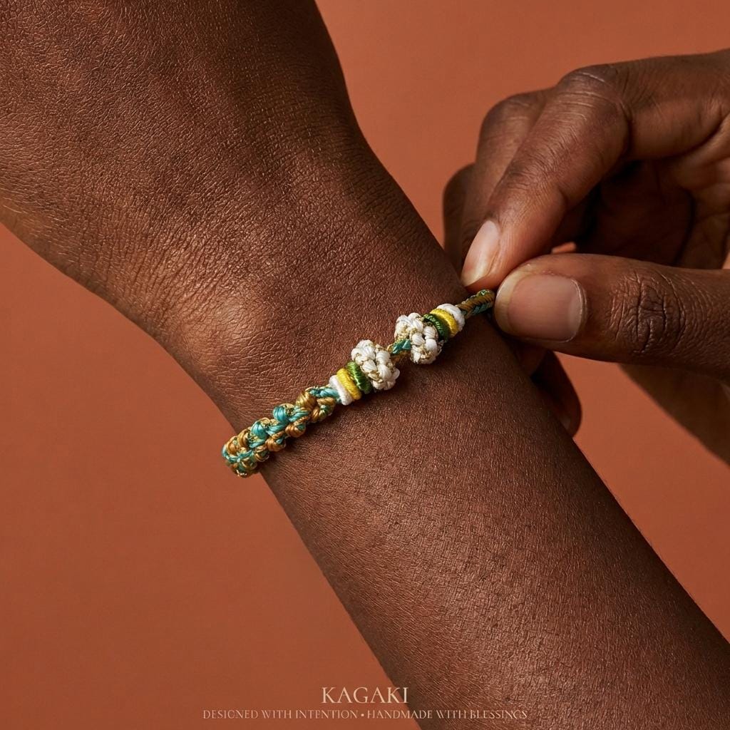 KAGAKI handwoven Tibetan cord bracelet in multicolor cotton with paired knots, top-down editorial flat-lay view, charm-friendly for daily intention and gifting