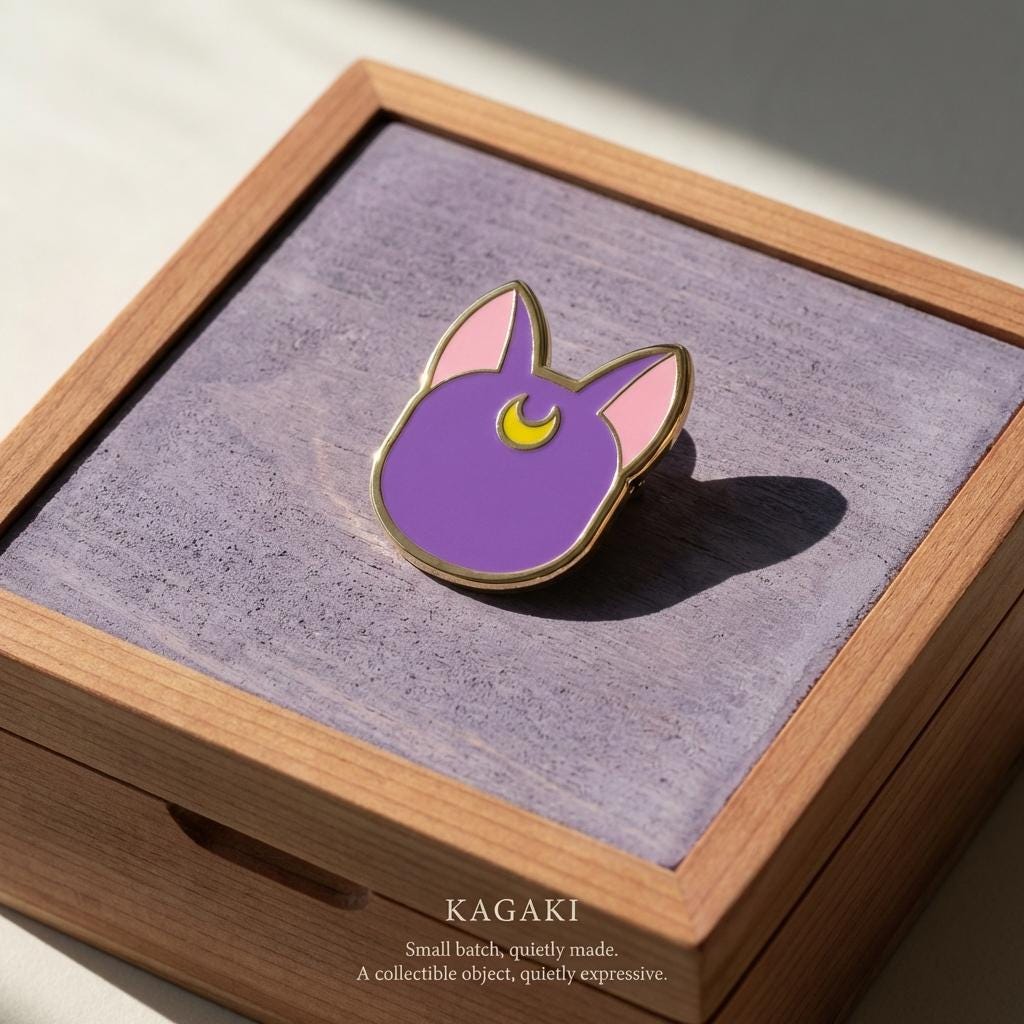 KAGAKI moon cat spiritual enamel pin in soft moonlight tones, on jacket, for daily wear and gifting