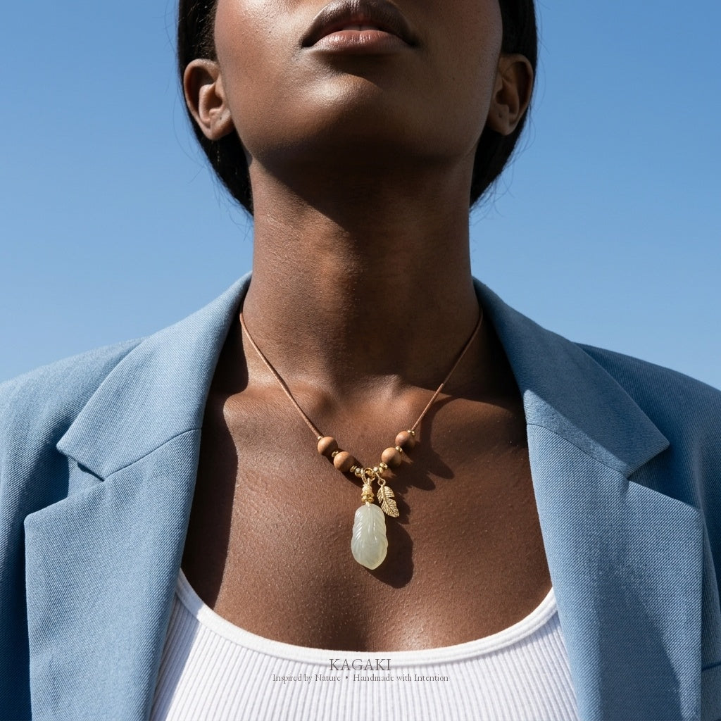 KAGAKI Plume green jade feather pendant sandalwood cord necklace, worn view, handmade feather necklace