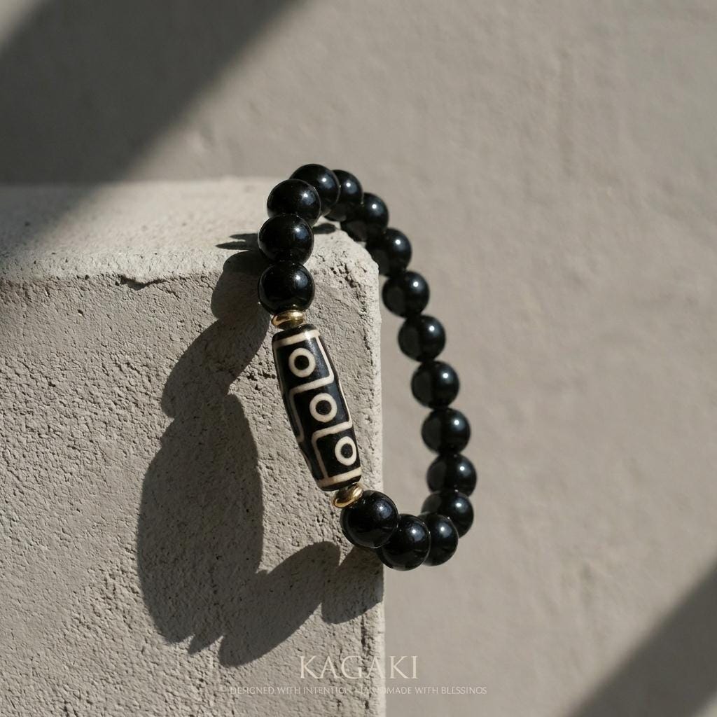 KAGAKI obsidian dzi bead bracelet in deep black obsidian, bead detail, for meditation and daily intention