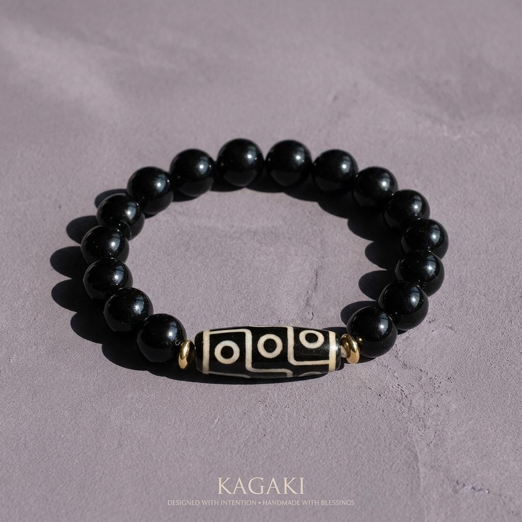 KAGAKI obsidian dzi bead bracelet in deep black obsidian, scale on hand, for meditation and daily intention