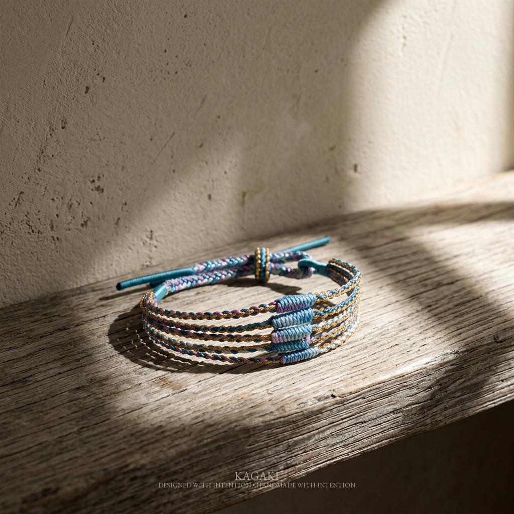 KAGAKI rainbow tibetan cord bracelet in rainbow multicolor, on wrist, for meditation and daily intention