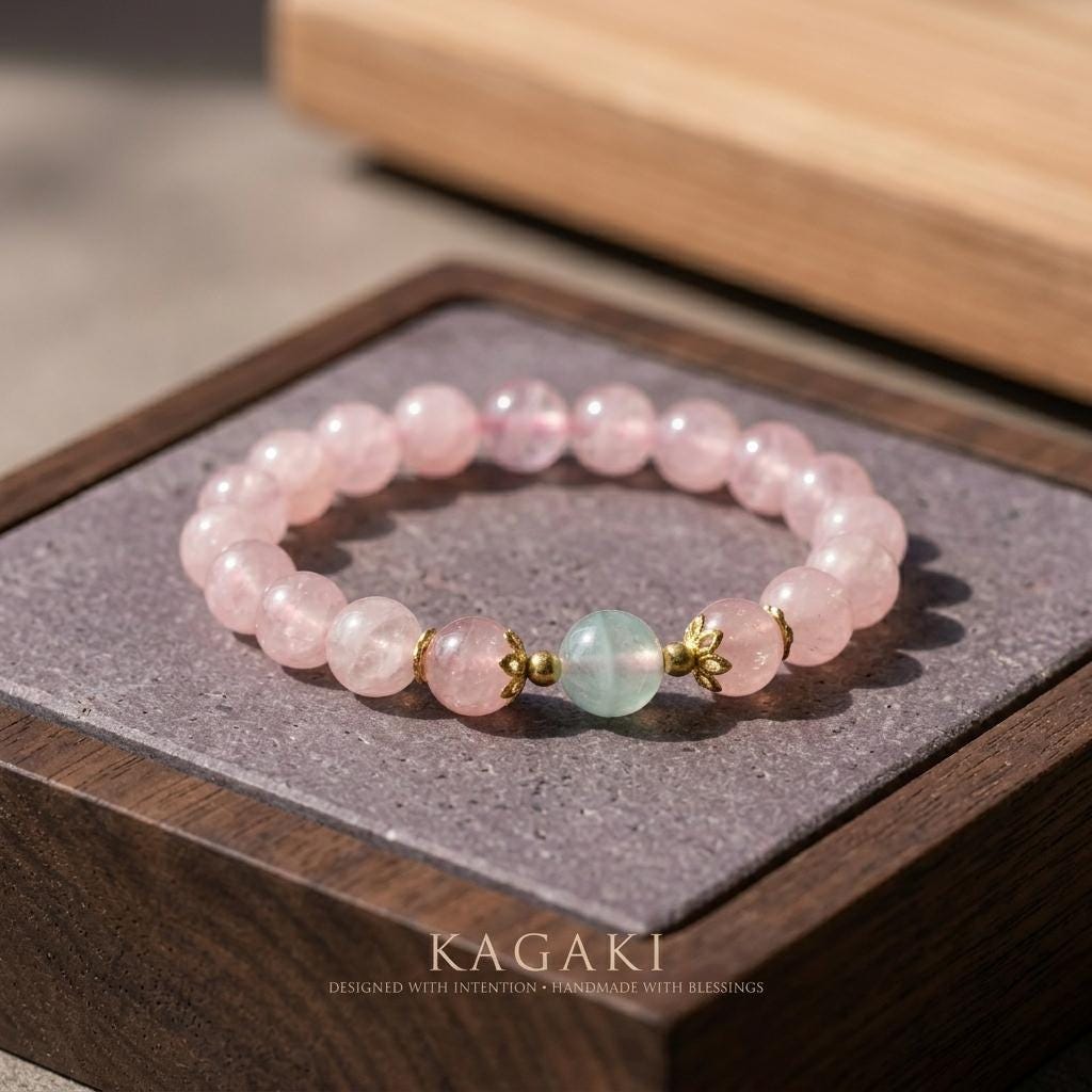 KAGAKI rose quartz blue accent bracelet in soft pink rose quartz with blue accents, on wrist, for meditation and daily intention