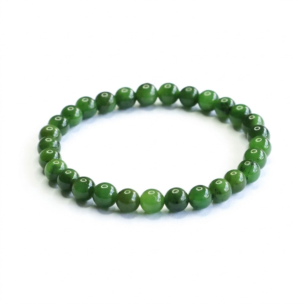 KAGAKI handmade spinach-green jade beaded bracelet, smooth round green jade beads on pure white background.