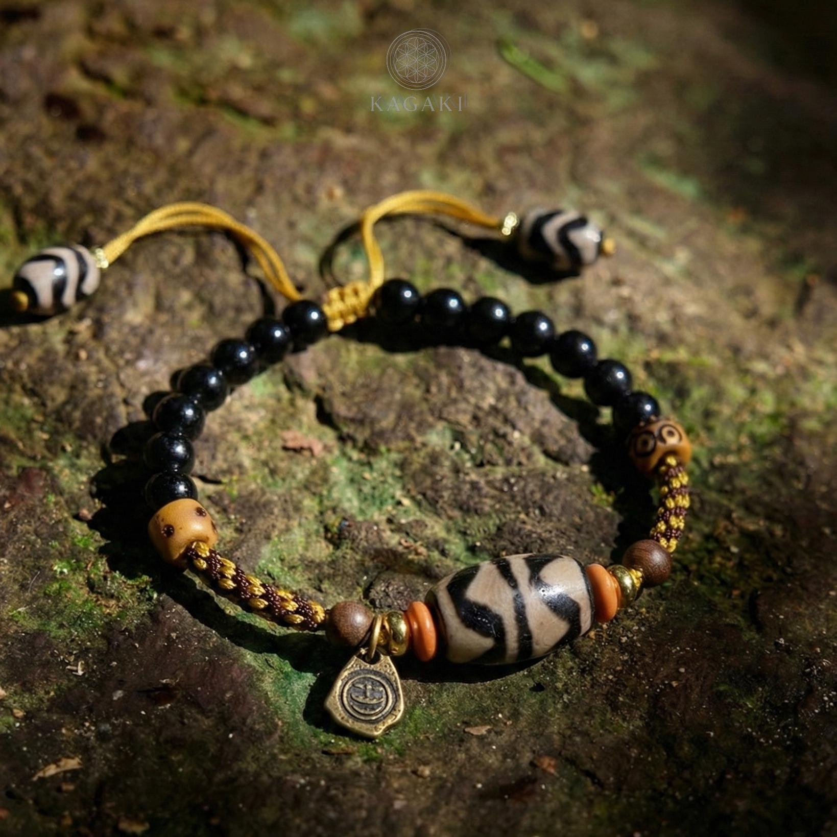 KAGAKI tibetan ceramic amulet cord bracelet in black with ceramic accent, scale on hand, for meditation and daily intention