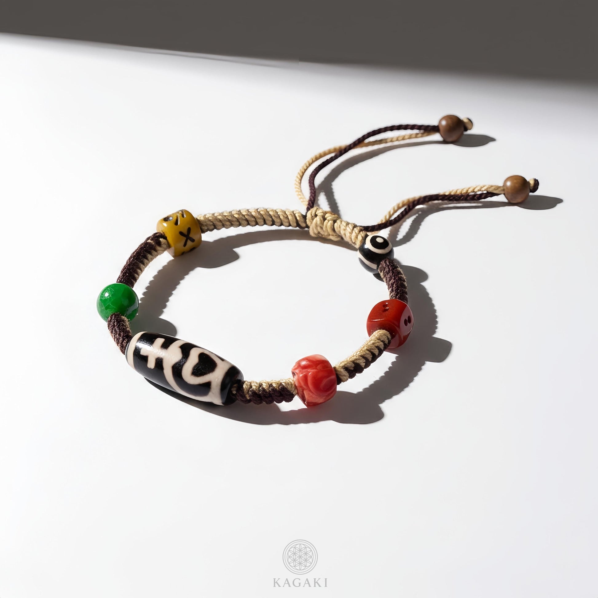 KAGAKI tibetan dzi cord amulet bracelet in natural earth tones with dzi bead, packaging detail, for meditation and daily intention