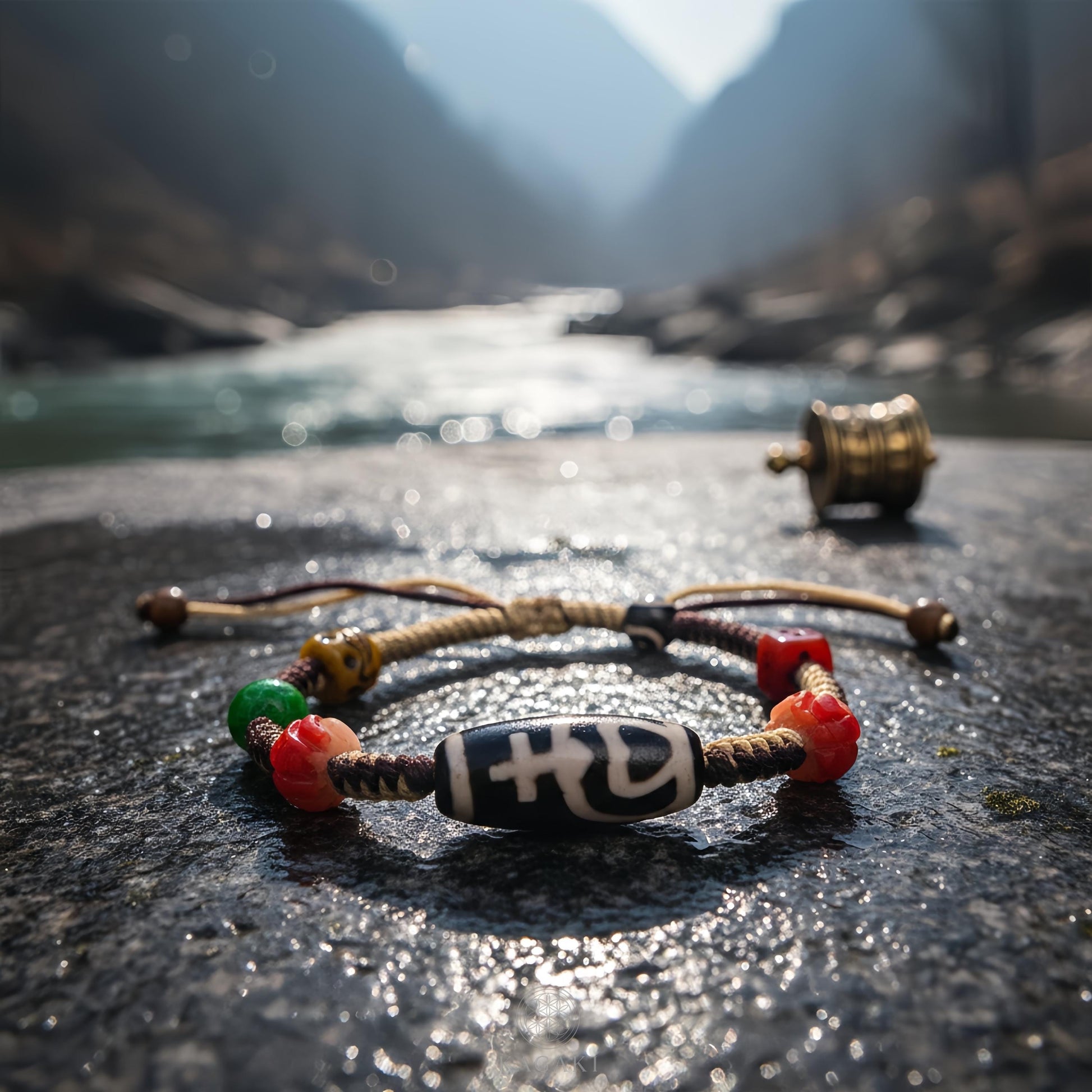 KAGAKI tibetan dzi cord amulet bracelet in natural earth tones with dzi bead, stone close up, for meditation and daily intention