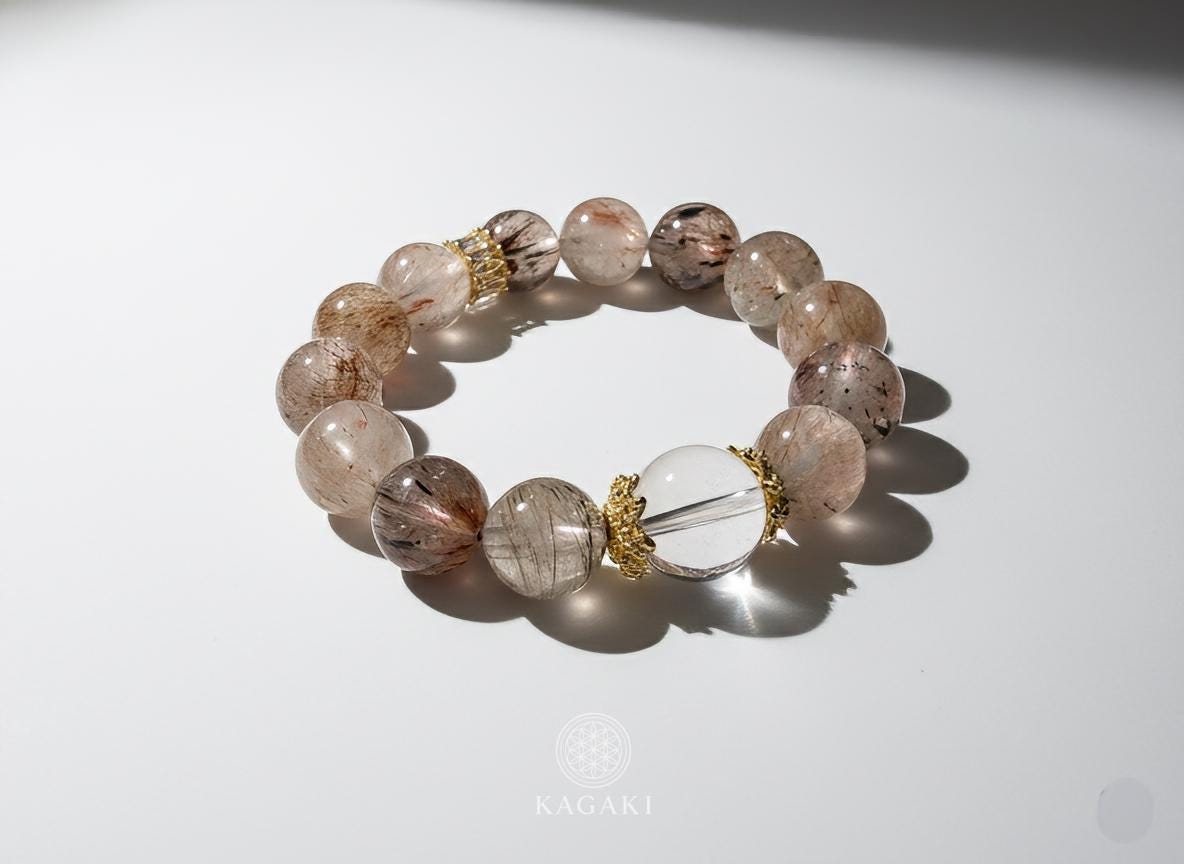 KAGAKI tourmalinated quartz bracelet in clear quartz with black tourmaline inclusions, flat lay, for meditation and daily intention